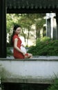 Chinese cheongsam model in Chinese classical garden